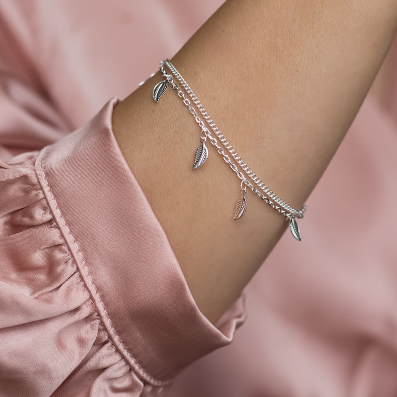 Delicate layered 925 sterling silver chain bracelet with tiny leaf charms