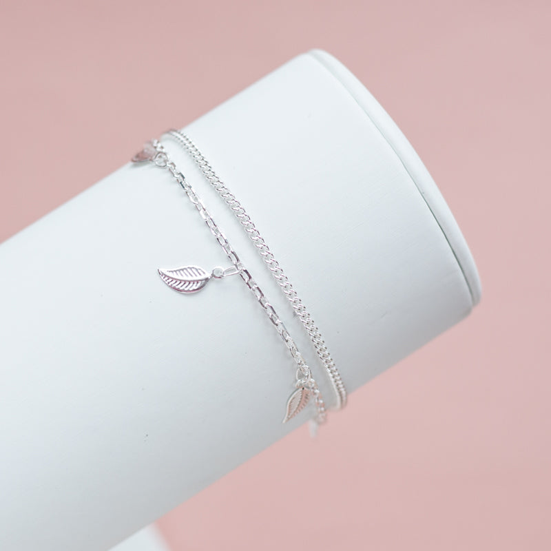Delicate layered 925 sterling silver chain bracelet with tiny leaf charms