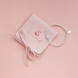 Fashionable little sliding Star silver stacking bracelet with Aquamarine gemstone