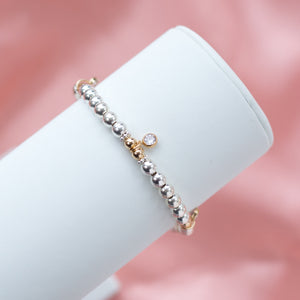 Elegant sterling silver stacking bracelet with 14k gold filled beads and Cubic Zirconia charms