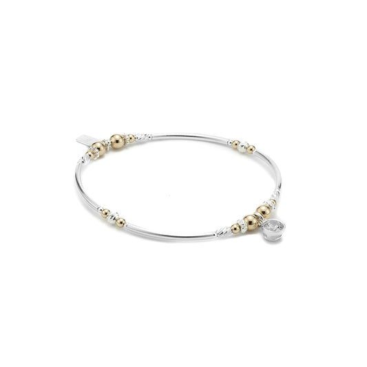 Elegant bangle bracelet with Cubic Zirconia charm and 14-karat gold