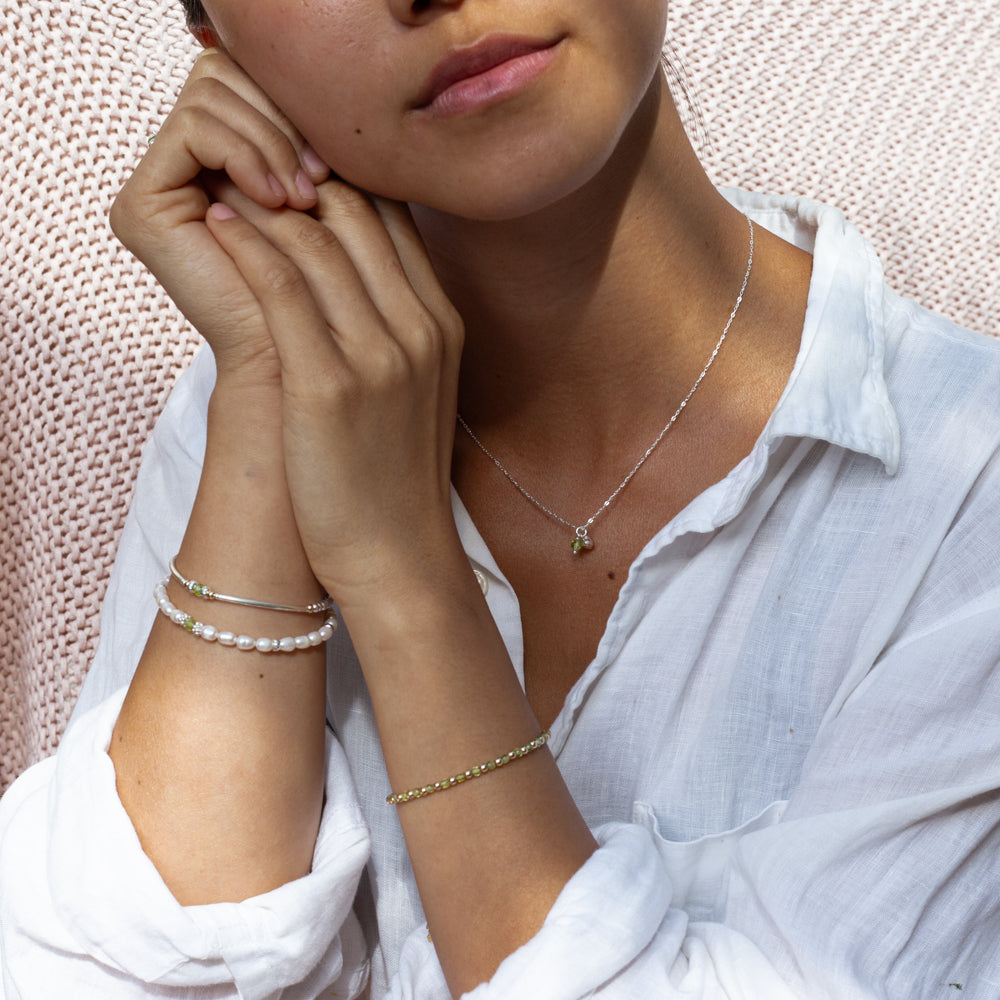 Elegant tube silver bracelet with Peridot gemstone and multicut silver beads