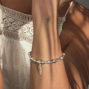 Beautiful Feather silver stacking bracelet with dazzling multicut silver beads