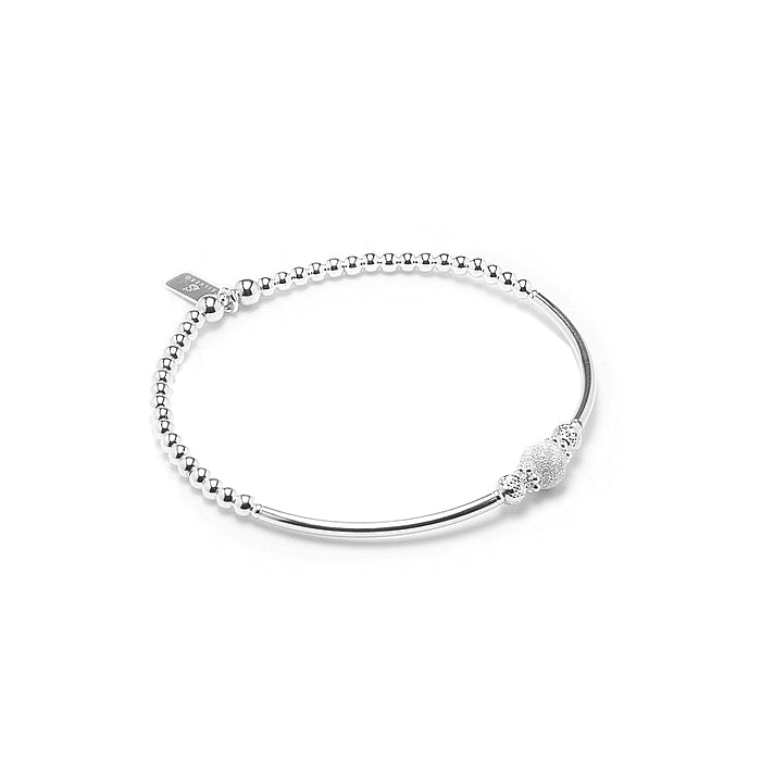 Elegant silver stacking bracelet with beautiful frosted ball