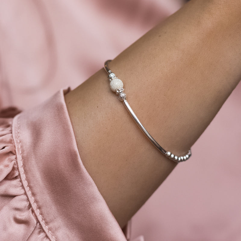 Elegant 925 sterling silver stacking bracelet with beautiful frosted ball