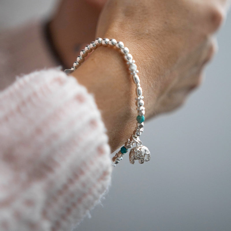 Oriental 925 sterling silver stretch stacking bracelet with Elephant charm and Turquoise gemstone