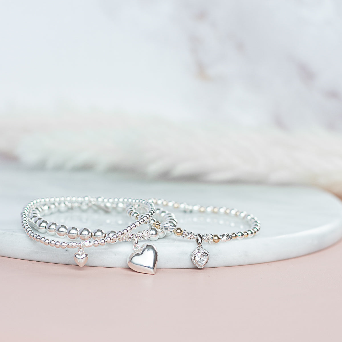 Minimalist silver stacking bracelet with adorable tiny Heart charm