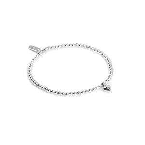 Minimalist silver stacking bracelet with adorable tiny Heart charm