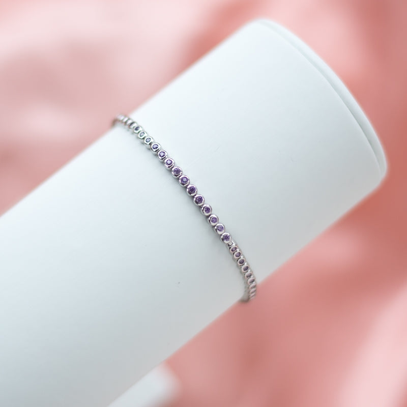 Highly elegant 925 Sterling silver bracelet decorated with violet Cubic Zirconia stones plated with Rhodium