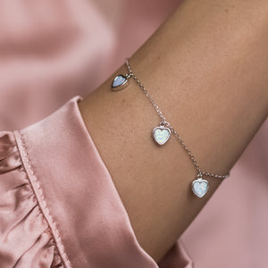 Adorable 925 sterling silver bracelet with white Opal heart charms